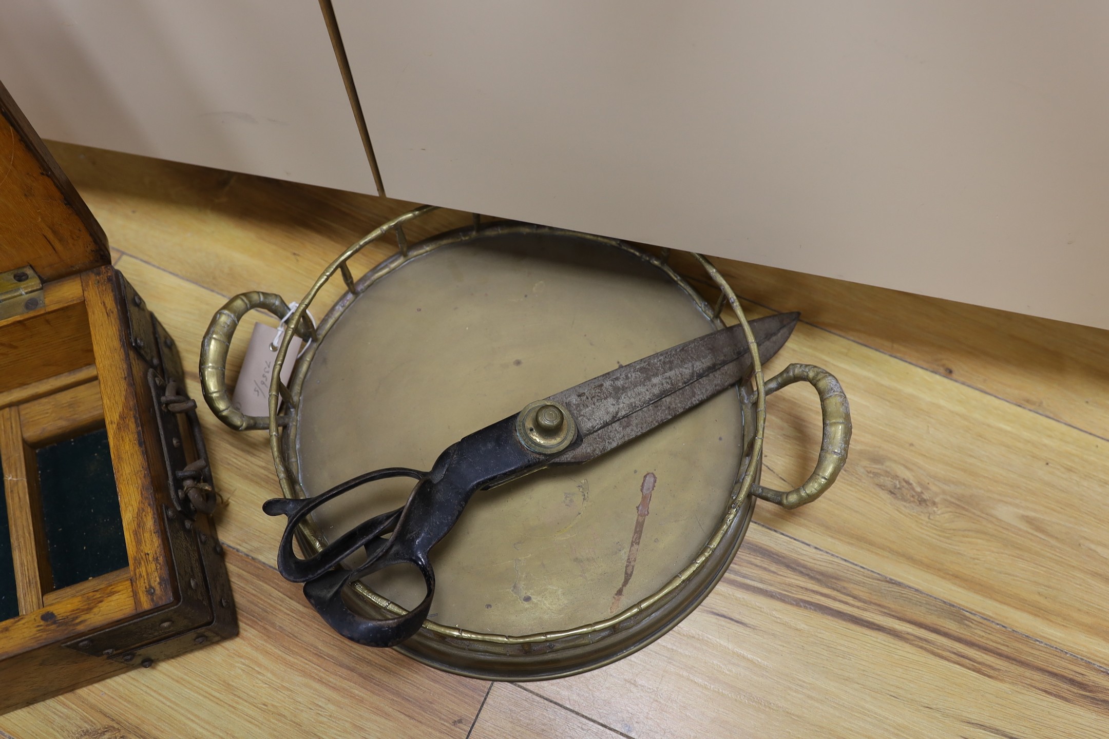 An oak and metal bound box, a circular brass tray and a pair of draper's scissors